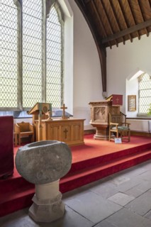 Interior showing stone baptismal font