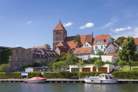 Pleasure boat in the Elde river moored at Plau am See