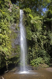 Benang Kelambu Waterfalls in tropical forest near the village Aik Berik