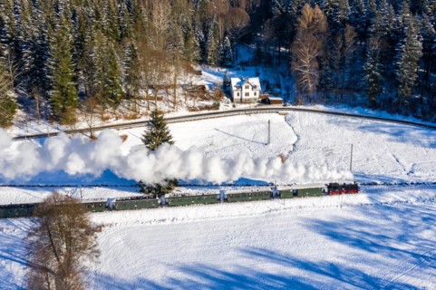 Pressnitztalbahn railway steam train steam locomotive in winter aerial view in Schmalzgrube