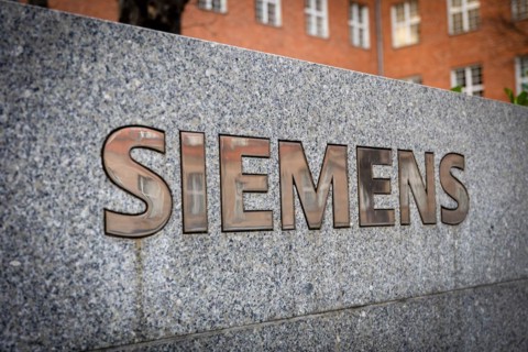 A Siemens company sign in front of a branch office in Siemensstadt in Berlin