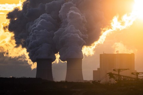 The Schwarze Pumpe coal-fired power plant stands out against the rising sun
