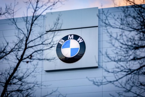 A sign of the car manufacturer BMW in front of a branch in Siemensstadt in Berlin