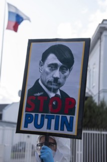 Protest poster in front of Russian embassy