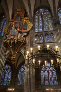 Suspended pipe organ and stained glass windows in the Cathedral of Our Lady of Strasbourg