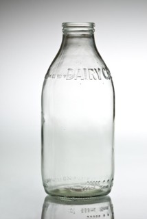 Empty clear glass milk bottle