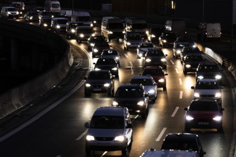 Congested traffic on the A100 looms at blue hour in Berlin