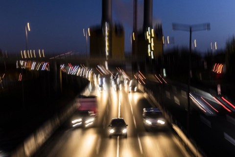 Traffic on the A100 looms at blue hour in Berlin