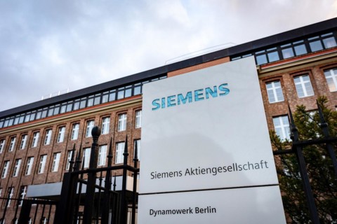 A Siemens company sign in front of a branch office in Siemensstadt in Berlin