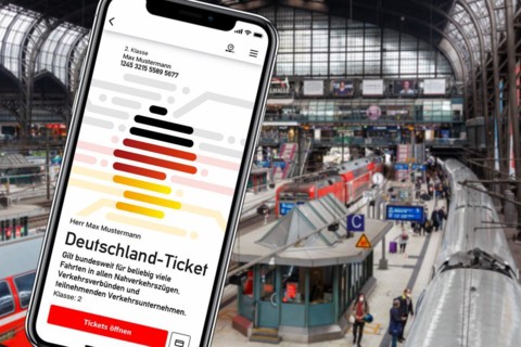 Germany ticket D-ticket or 49 euro ticket on a mobile phone Photo montage at Hamburg Central Station