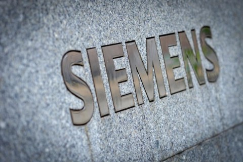 A Siemens company sign in front of a branch office in Siemensstadt in Berlin