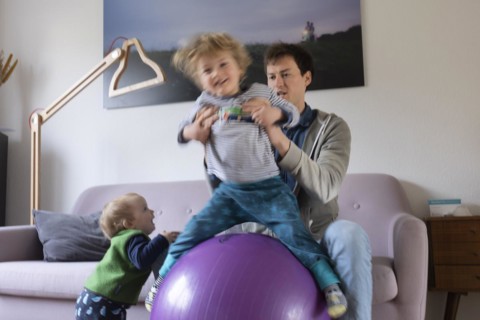 Subject: Father romping with his children