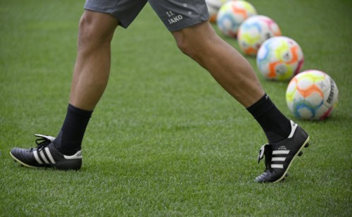 Coach with Adidas Copa Mundial sports shoe