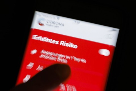 The Corona Warn app displays the words Increased Risk on a smartphone. Berlin