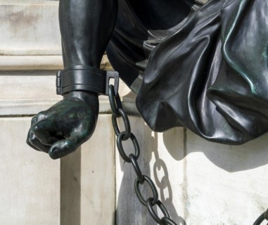Detail photo of the chained warriors at the base of the equestrian statue of Frederick William of Brandenburg