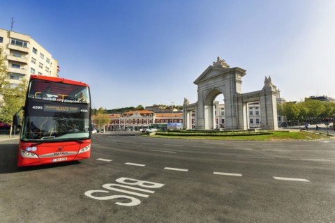 Monumental gate Puerta de San Vicente in a roundabout