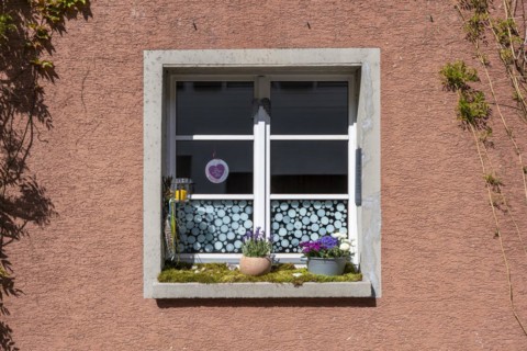 Window with decoration on the window sill in the old town of Radolfzell on Lake Constance