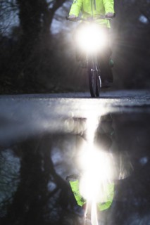 A man rides his bicycle along the Teltow Canal in Berlin