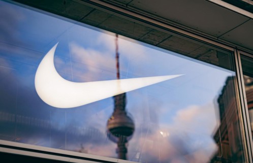 The logo of the sporting goods manufacturer NIKE in a branch in Berlin. 02.02.2022.