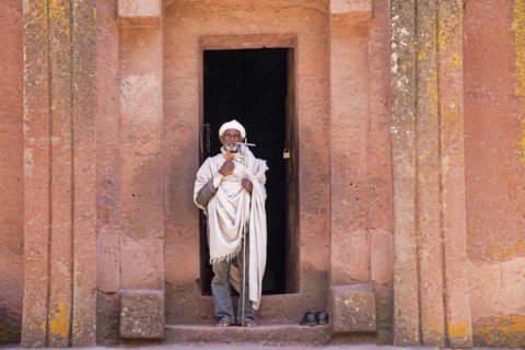 Priest leaving the Biete Gabriel-Rufael