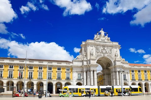 Tramway in front of the Arc de Triomphe Arco da Rua Augusta