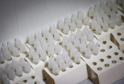 Rapid test sample cups ready for use in a COVID-19 vaccination and testing centre at Autohaus Olsen in Iserlohn