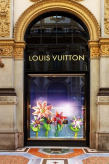 Shop window of the luxury shop LOUIS VUITTON at Galleria Vittorio Emanuele II
