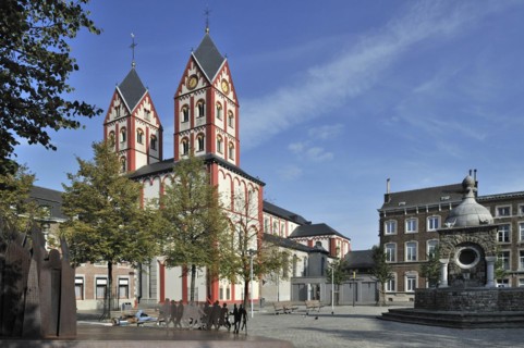 Fountain and the Church of Saint Bartholemew at the place Saint-Barthelemy