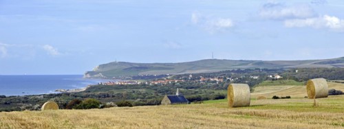 Mowed field with view over the village Escalles and Cap Blanc Nez with obelisk of the Dover Patrol Memorial