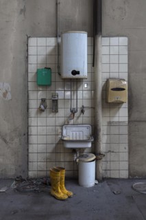 Hand basin with instantaneous water heater in a factory hall in a former paper factory