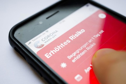 The Corona Warn app displays the words Increased Risk on a smartphone. Berlin