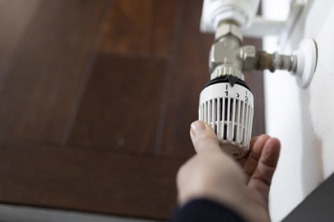 Thermostat on a radiator in a detached house