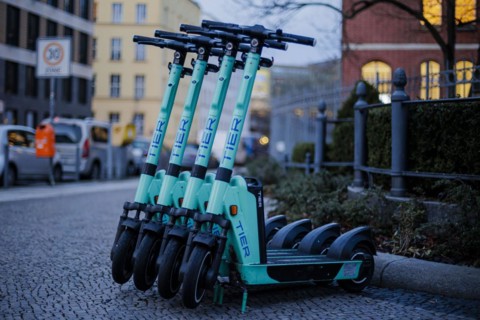EScooters of the eScooter and bike rental company TIER stand on a pavement in Berlin Mitte. Berlin