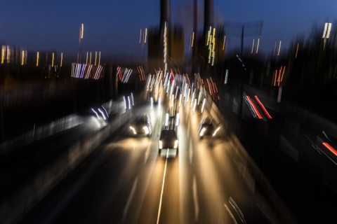 Traffic on the A100 looms at blue hour in Berlin
