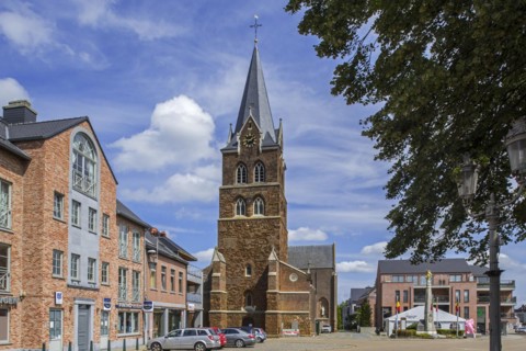 Church and gilded equestrian statue on market square remembering Battle of the Silver Helmets