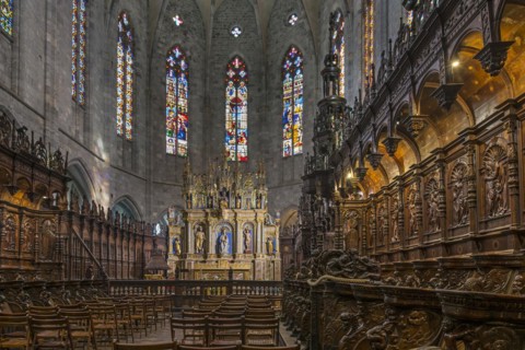 Carved wooden choir stalls and altar in the Cathedrale Notre-Dame de Saint-Bertrand-de-Comminges cathedral