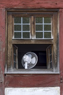 Window with fan to cool the room in hot weather