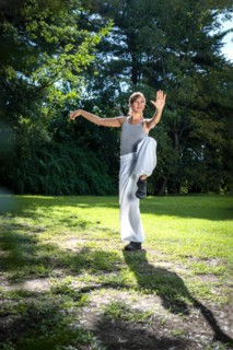 Kung Fu student woman practicing the activity for holding balance