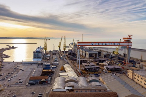 The Fincantieri shipyard in the industrial harbour at dusk