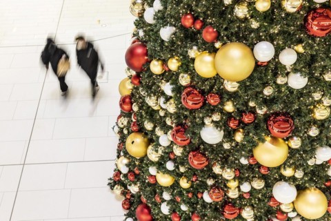 People stand out against Christmas decorations in a shopping centre on Schlossstrasse in Berlin