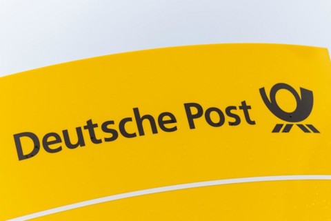 The logo of the Deutsche Post AG company at a distribution centre in Hanover