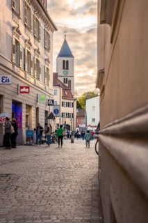 Lively cobblestone alleyway alley in the light of the evening sun