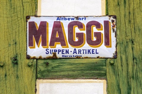 Rusty historical enamel sign