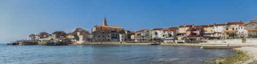 Panoramic photo of the beach and city view of the coastal town of Umag