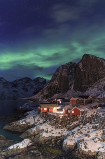 Northern Lights or Aurora Borealis over red rorbuer