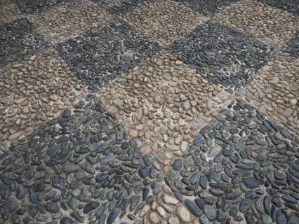 Concrete and pebble tiles floor