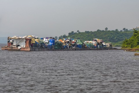 Overloaded riverboat on the Congo river