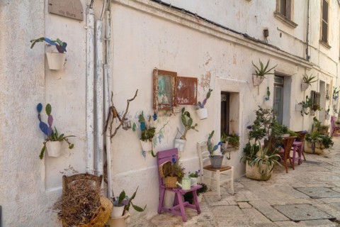 Chairs and floral decoration in the old town of Locorotondo