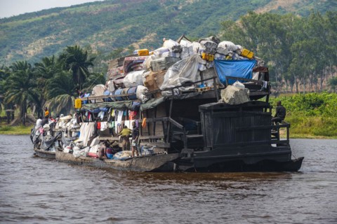 Overloaded riverboat on the Congo river