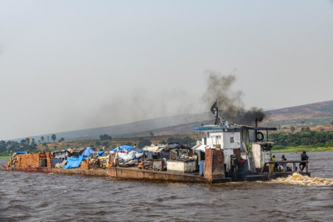 Overloaded riverboat on the Congo river